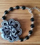 Unique Black and White Beaded Bracelet with a Floral Centre Piece