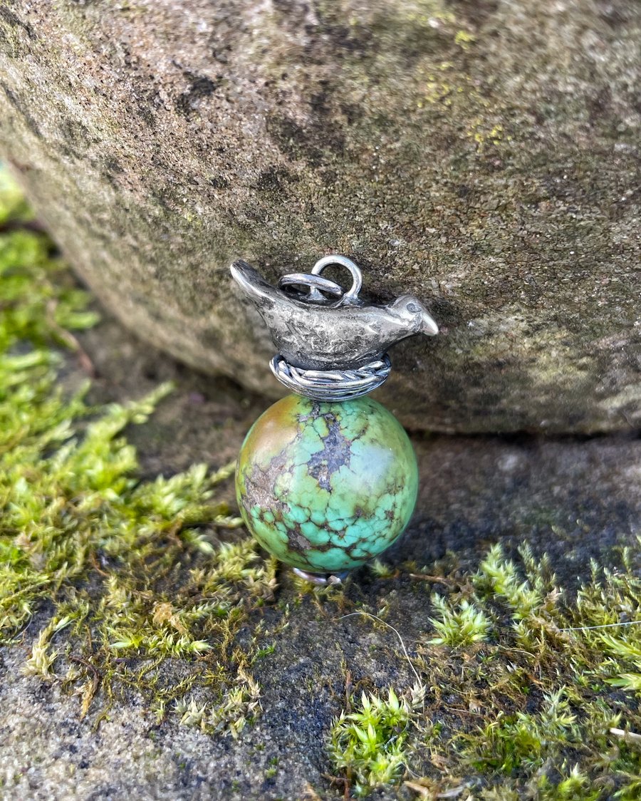 Sterling silver bird in nest and big turquoise bead pendant.