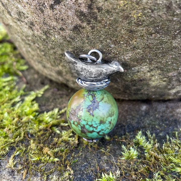 Sterling silver bird in nest and big turquoise bead pendant.