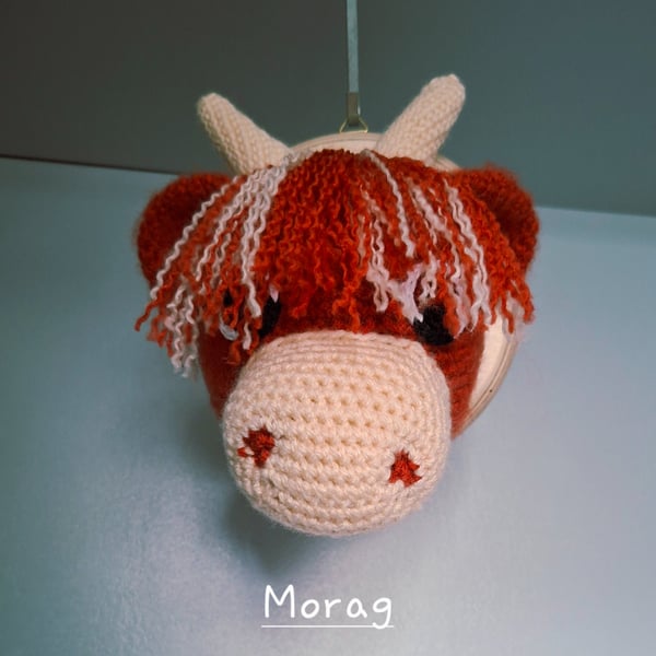 Crocheted Highland coo trophy head on wooden board