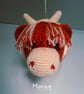 Crocheted Highland coo trophy head on wooden board