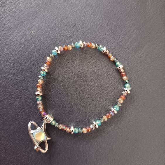 Elasticated multi-coloured beaded bracelet with star charm 