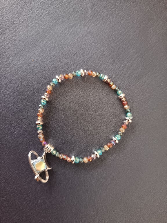 Elasticated multi-coloured beaded bracelet with star charm 