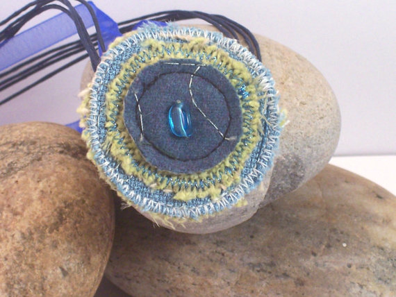 Circular fabric necklace with ribbon and glass bead 