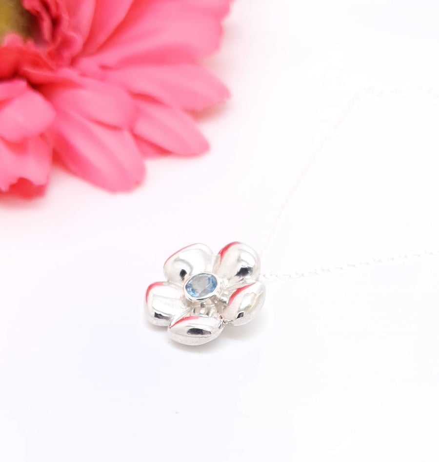 Sterling silver flower pendant with blue topaz - slight second 