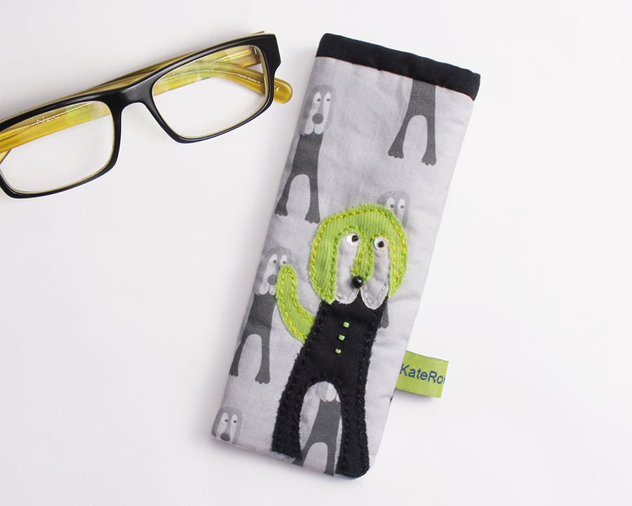 Monochrome dog print glasses case with appliqué dog with green ears and tail