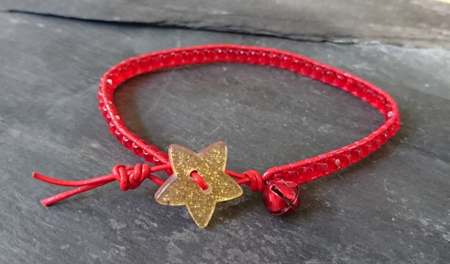Festive red leather and bead bracelet with gold star button and bell