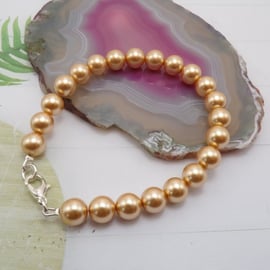 Gold Round Pearl beaded Silver Bracelet.