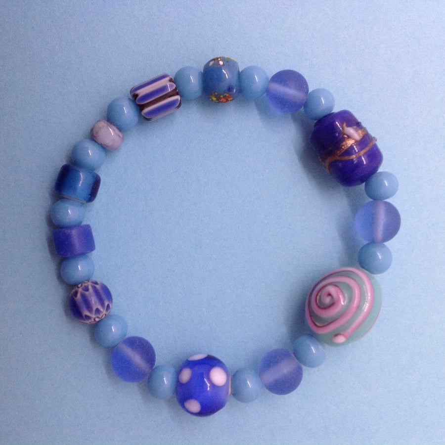 stretchy blue and turquoise bracelet with unusual bead collection 6.5"
