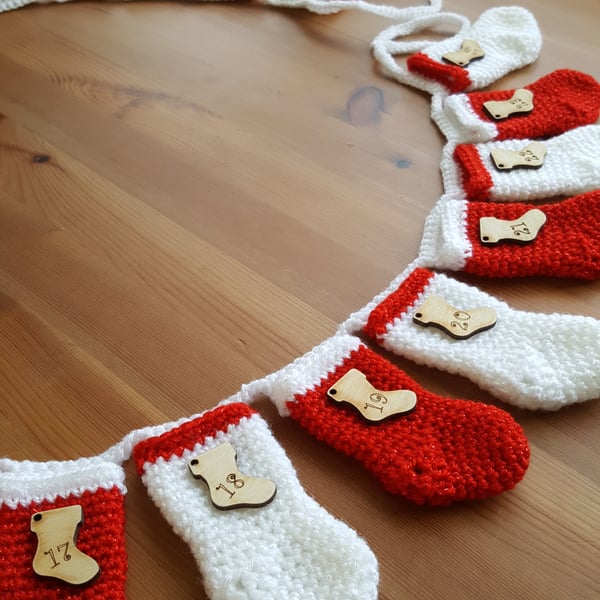 festive crocheted christmas stocking garland, red and white sparkly