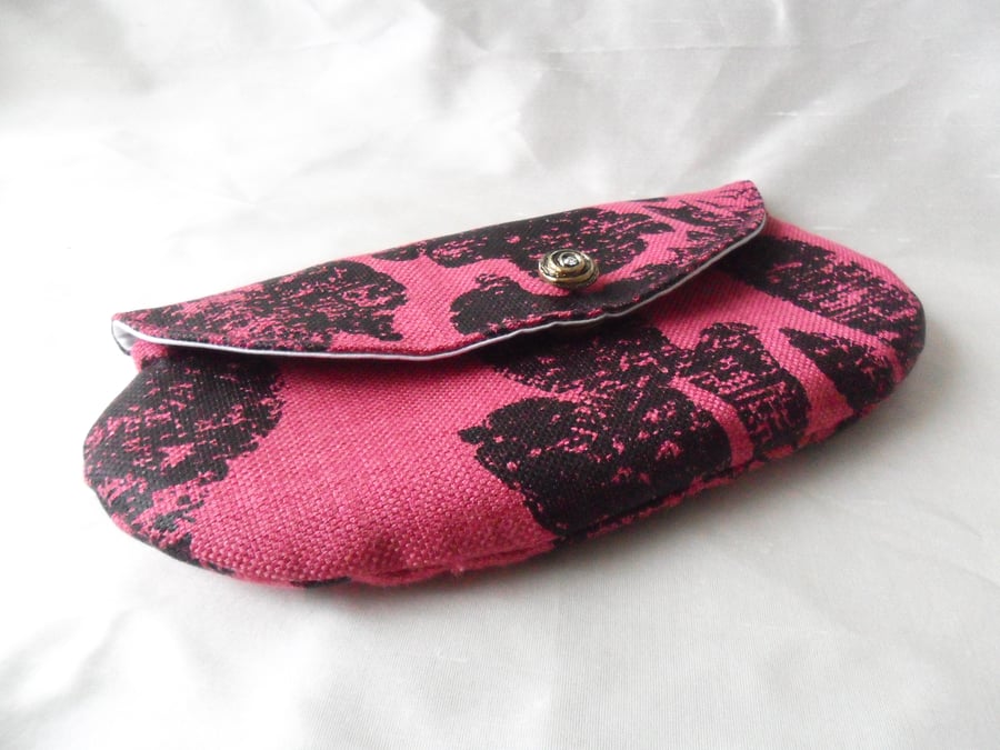 Mini makeup or clutch bag in deep pink and black