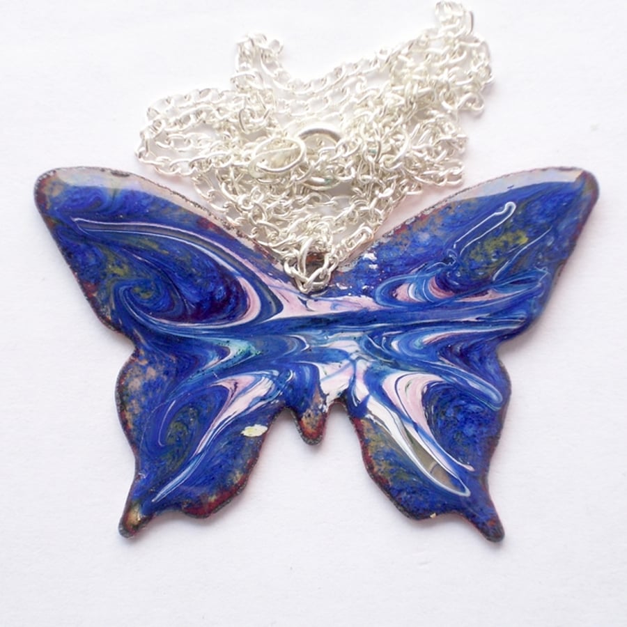 pendant - butterfly scrolled pink and white on dark blue
