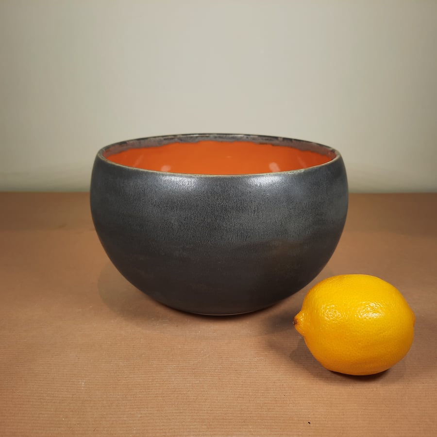 Large ceramic rounded burnt orange bowl