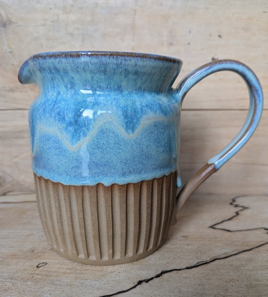 Larger pale turquoise green carved jug
