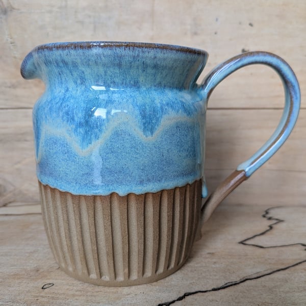 Larger pale turquoise green carved jug