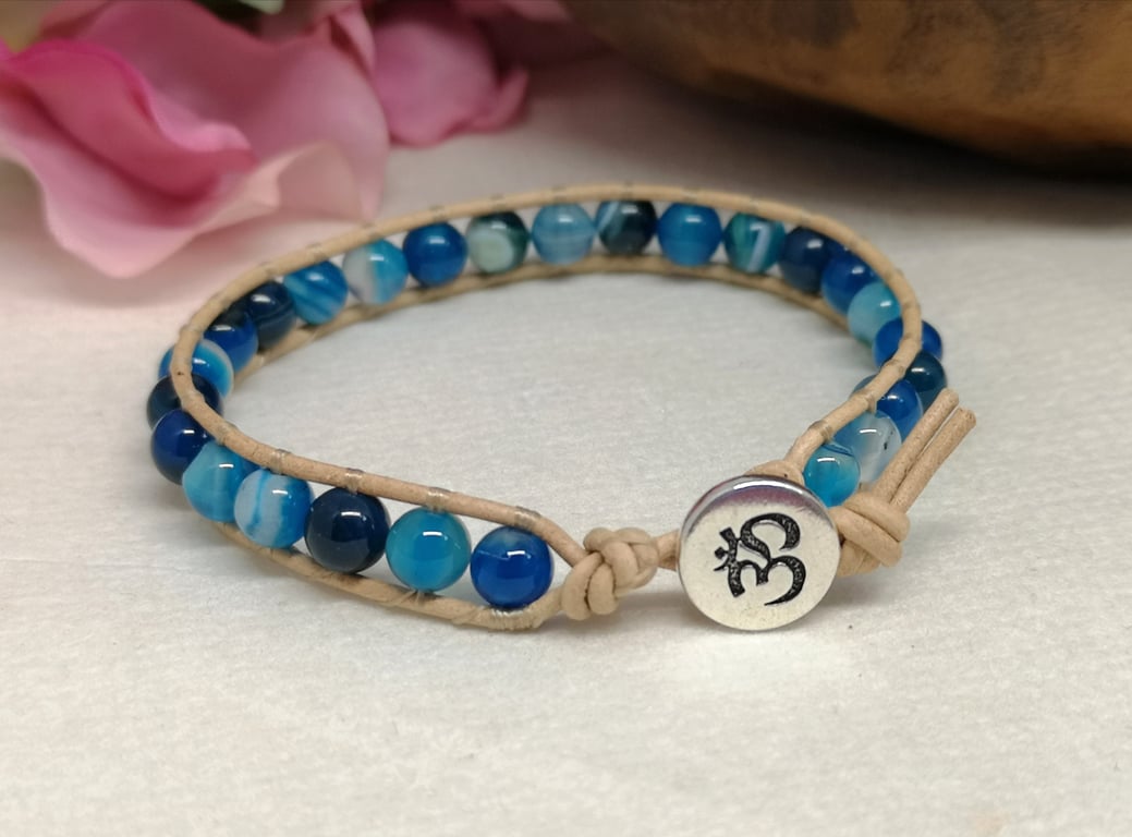 Blue agate and tan leather with Om button fastener 