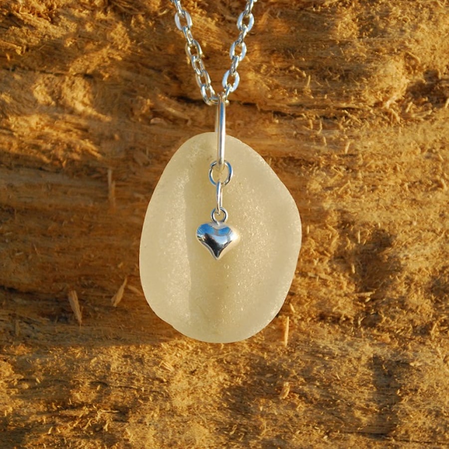 White sea glass pendant with sterling silver heart