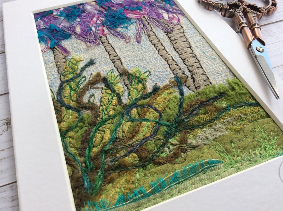 Up-cycled embroidered tree and plants landscape. 