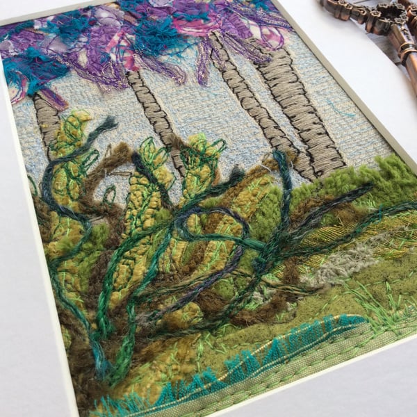 Up-cycled embroidered tree and plants landscape. 