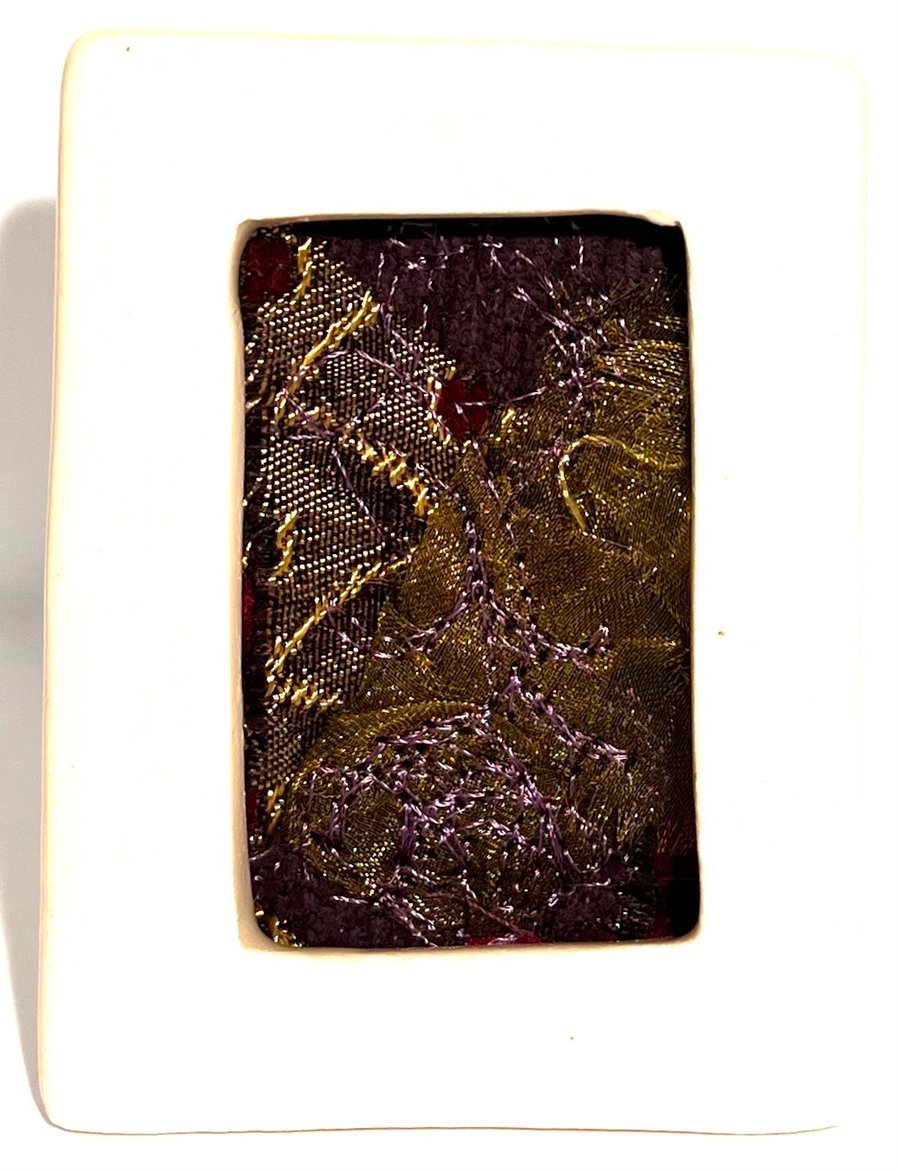 Gold & pink abstract collage with free-motion embroidery in mini porcelain frame