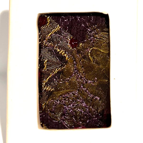 Gold & pink abstract collage with free-motion embroidery in mini porcelain frame