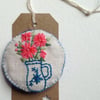 Embroidered linen brooch