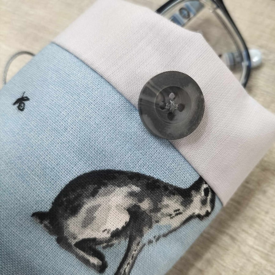 Glasses case with hares on blue background