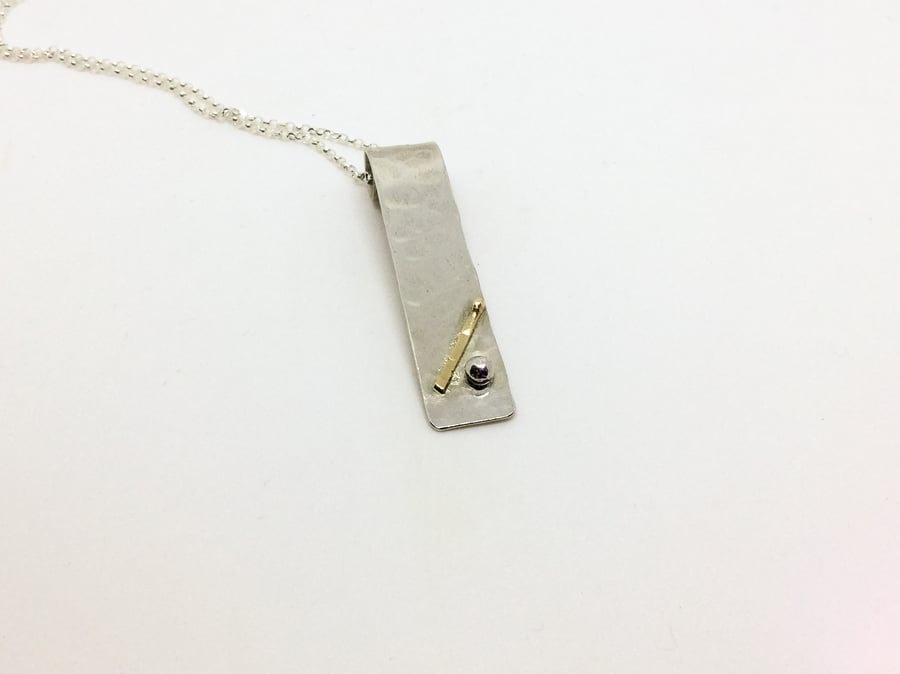 Sterling Silver Textured Pendant With 9ct Gold decoration. 