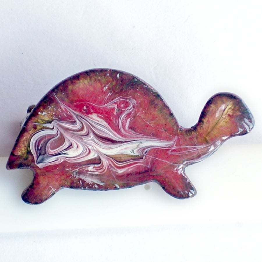 brooch - tortoise scrolled white on red over clear enamel