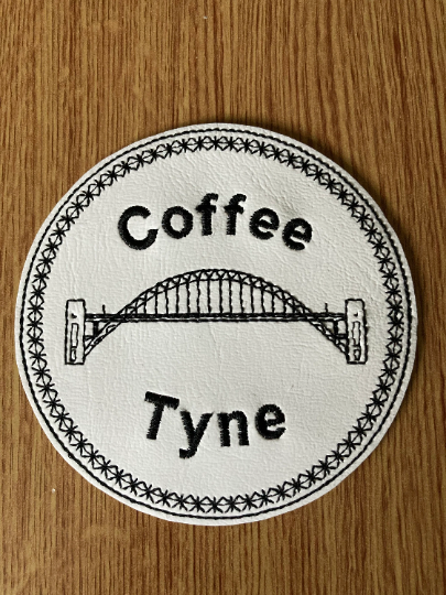 1105. Coffee Tyne star border round coaster.