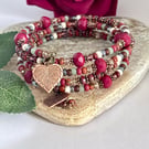 Deep red handmade Czech glass memory wire wrap bracelet with leaf charms