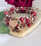 Deep red handmade Czech glass memory wire wrap bracelet with leaf charms