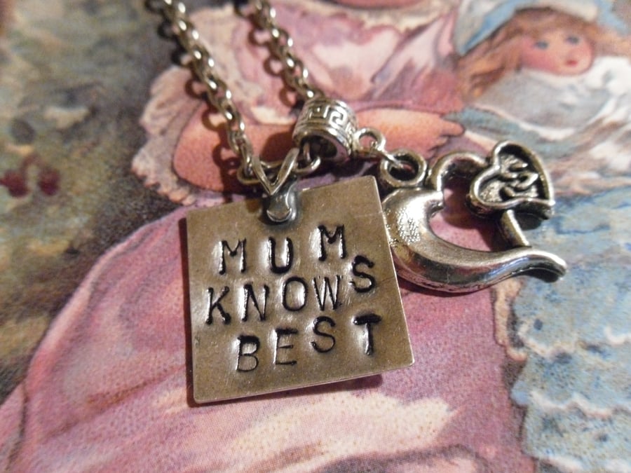 Hand stamped Mum knows best pendant.