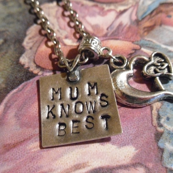 Hand stamped Mum knows best pendant.