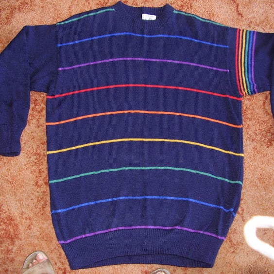 Navy jumper for men or women with a narrow rainbow stripe