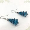Crystal silver or petrol blue marguerite tree dangle earrings with hematite star