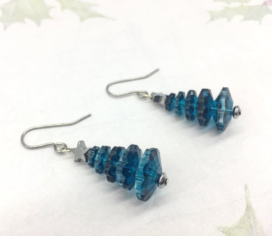 Crystal petrol blue marguerite tree dangle earrings with hematite star