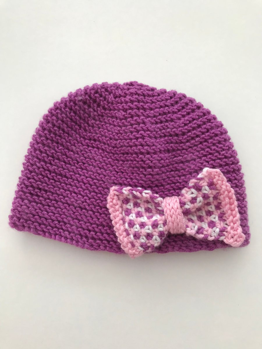 Hand knitted baby cloche hat with bow