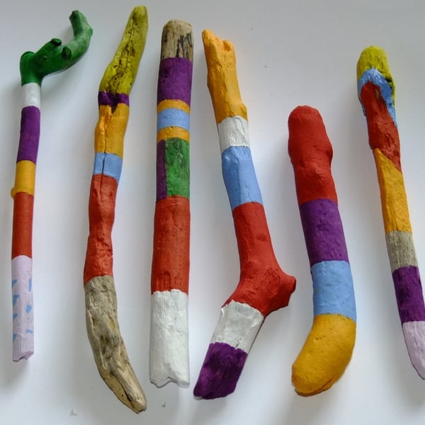 Colourful driftwood hand painted vase fillers, ideal for decorating a room.