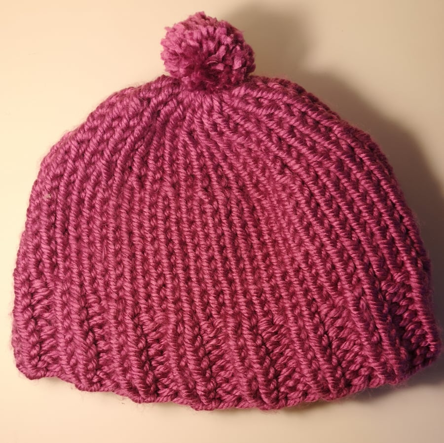 Handknitted dusty pink bobble hat