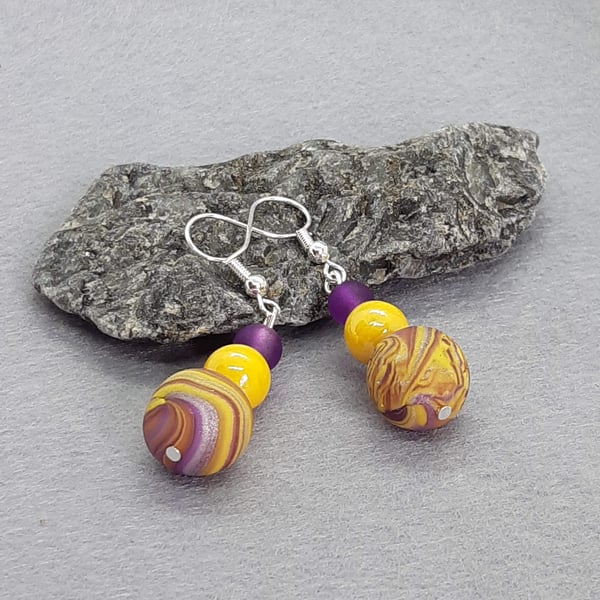 Yellow and purple dangly earrings