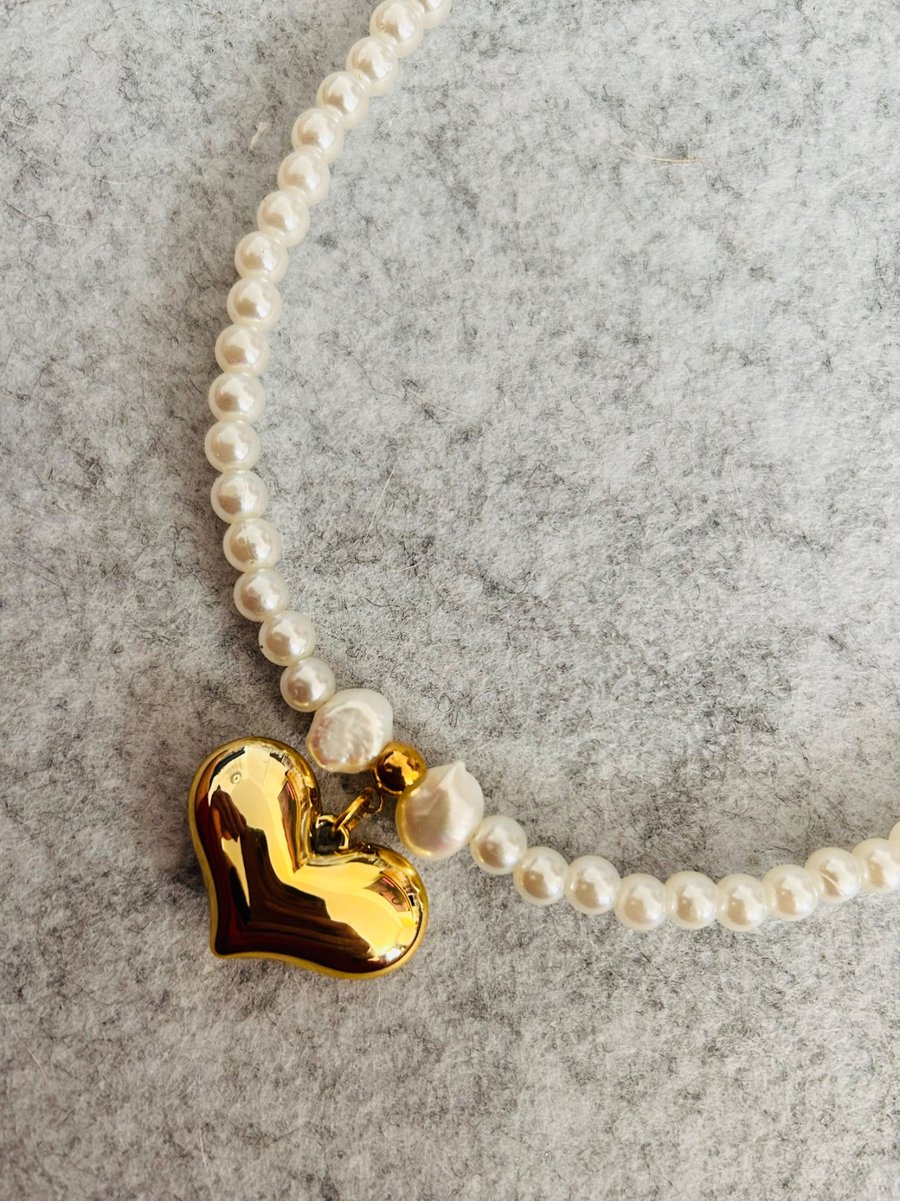 Pearl necklace and gold heart
