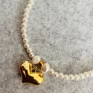 Pearl necklace and gold heart