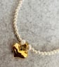 Pearl necklace and gold heart