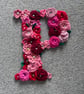 Initial P - crocheted flowers on a plywood backboard