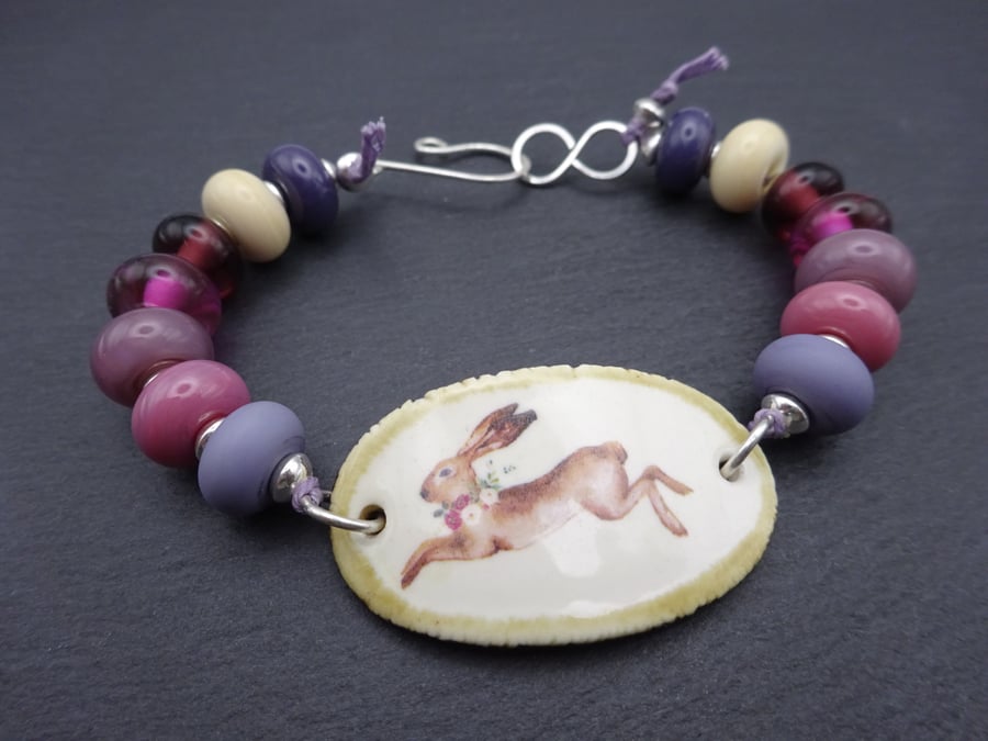 ceramic hare bracelet, purple and pink lampwork glass jewellery