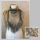 Crocheted triangle scarf with tassels