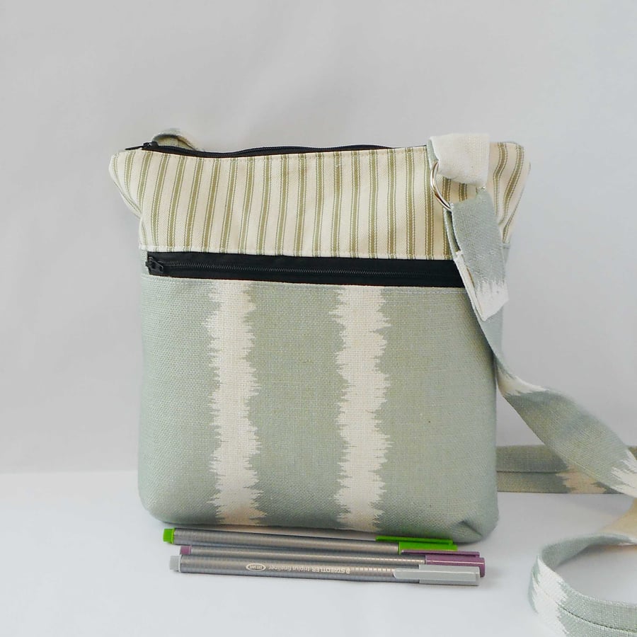 Striped linen and cotton fabric crossbody bag with zipped pocket 