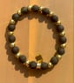 Handmade Black Beaded Bracelet with Gold-Tone Spacers - Image 1