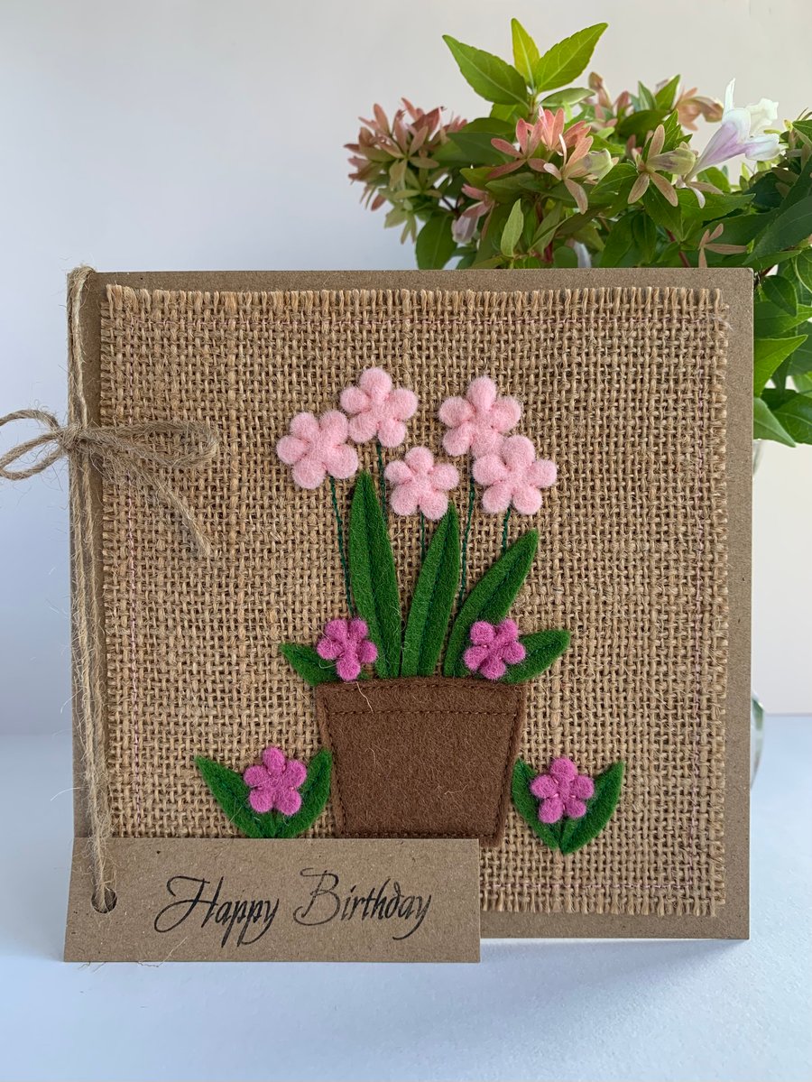 Handmade Birthday Card. A pot of pale pink and rose pink flowers from wool felt.